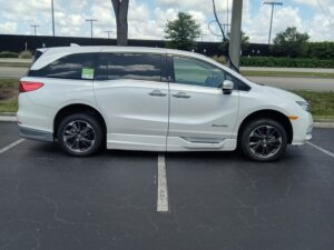 White Honda Odyssey with BraunAbility Side Entry Automatic In Floor conversion