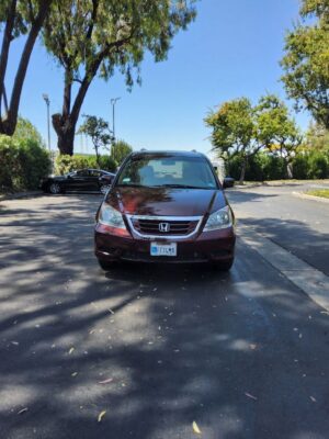 Red Honda Odyssey with BraunAbility Side Entry Automatic Fold Out conversion