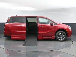 Red Honda Odyssey with BraunAbility Side Entry Automatic In Floor conversion