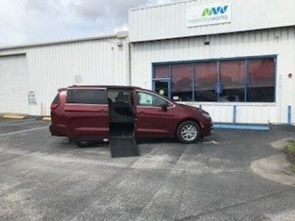 Red Chrysler Pacifica with Adaptive Vans Side Entry Automatic Fold Out conversion