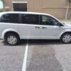 White Dodge Grand Caravan with BraunAbility Rear Entry Automatic Fold Out conversion