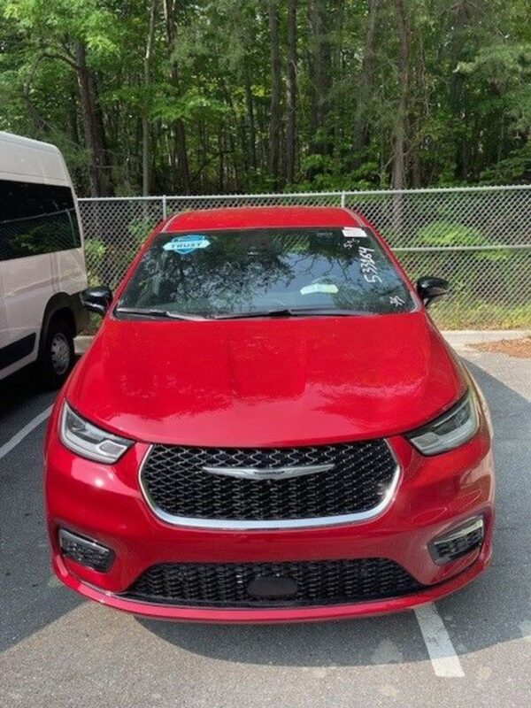 Red Chrysler Pacifica with BraunAbility Side Entry Automatic Fold Out conversion