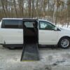 White Dodge Grand Caravan with Driverge Side Entry Automatic Fold Out conversion