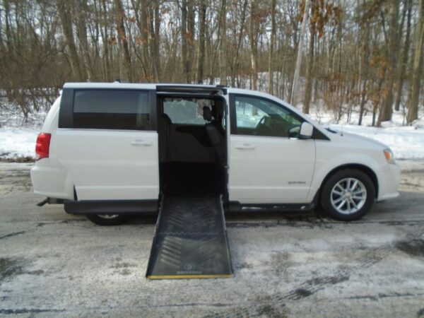 White Dodge Grand Caravan with Driverge Side Entry Automatic Fold Out conversion
