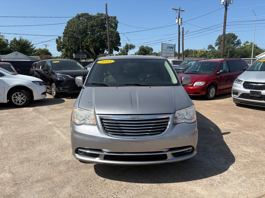 Silver Chrysler Town and Country with BraunAbility Side Entry Manual Fold Out conversion