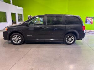 Black Dodge Grand Caravan with BraunAbility Side Entry Manual Fold Out conversion
