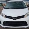 White Toyota Sienna with Driverge Rear Entry Manual Fold Out conversion