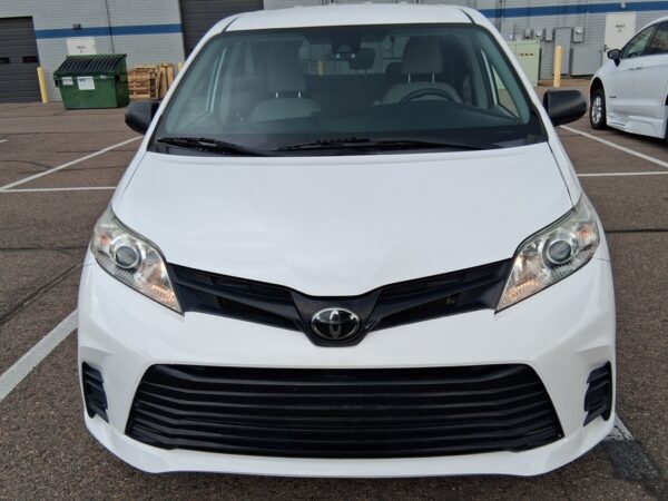 White Toyota Sienna with Driverge Rear Entry Manual Fold Out conversion