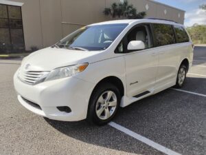 White Toyota Sienna with BraunAbility Side Entry Automatic Fold Out conversion