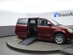 Red Dodge Grand Caravan with BraunAbility Side Entry Automatic Fold Out conversion