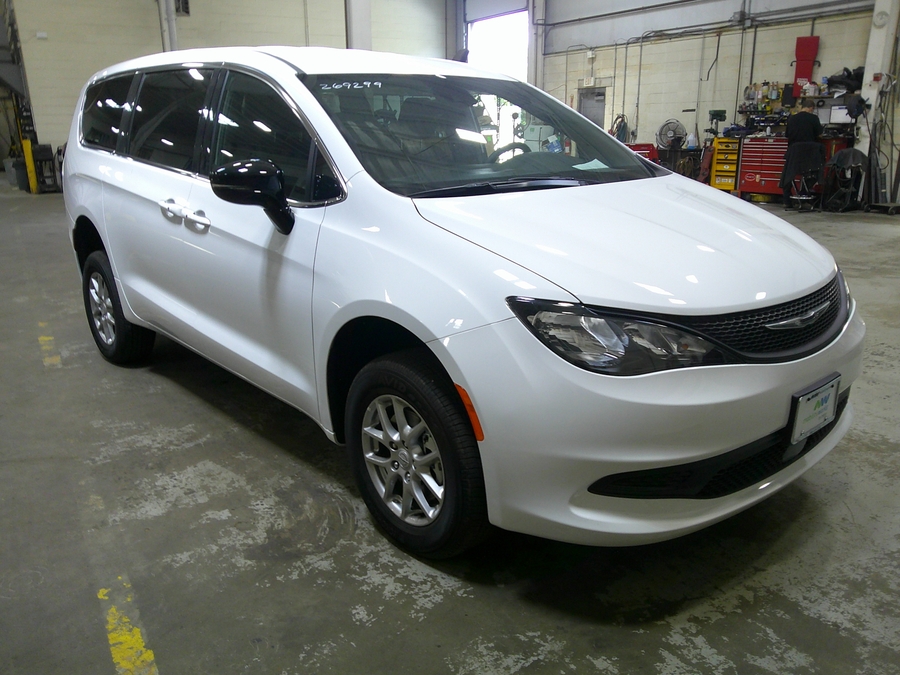 White Chrysler Voyager with FR Conversions Rear Entry Manual Fold Out conversion