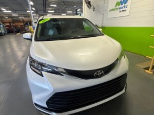 White Toyota Sienna with Driverge Rear Entry Manual Fold Out conversion