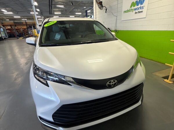 White Toyota Sienna with Driverge Rear Entry Manual Fold Out conversion