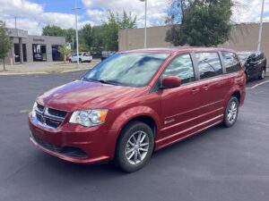 Red Dodge Grand Caravan with BraunAbility Side Entry Automatic Fold Out conversion