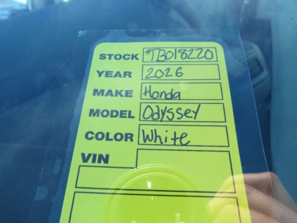 White Honda Odyssey with BraunAbility Side Entry Automatic In Floor conversion