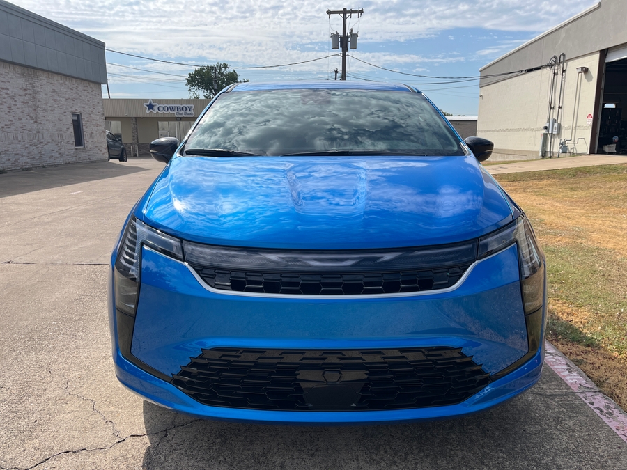 Blue Chrysler Pacifica with Driverge Side Entry Automatic Fold Out conversion