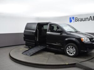 Black Dodge Grand Caravan with BraunAbility Side Entry Automatic Fold Out conversion