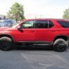 Red Chevrolet Traverse with BraunAbility Side Entry Automatic In Floor conversion