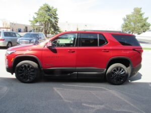 Red Chevrolet Traverse with BraunAbility Side Entry Automatic In Floor conversion