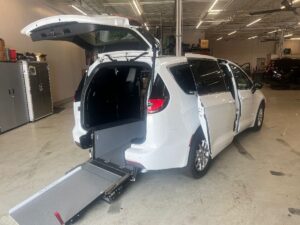 White Chrysler Pacifica with Driverge Rear Entry Manual Fold Out conversion