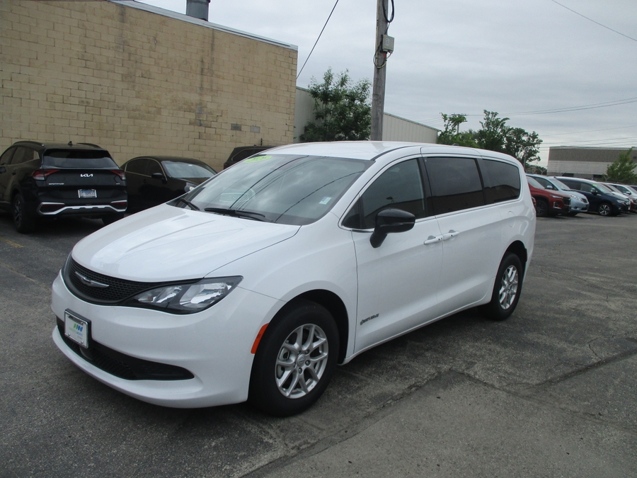 White Chrysler Voyager with Driverge Side Entry Automatic Fold Out conversion