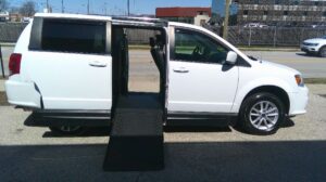 White Dodge Grand Caravan with Adaptive Vans Side Entry Automatic Fold Out conversion