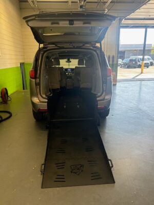 Silver Chrysler Pacifica with Freedom Motors Rear Entry Manual Fold Out conversion