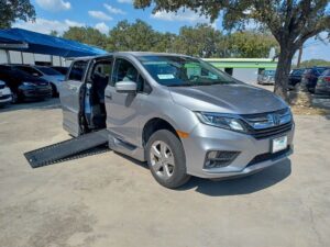 Silver Honda Odyssey with BraunAbility Side Entry Automatic In Floor conversion