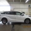 White Toyota Sienna with Driverge Rear Entry Manual Fold Out conversion