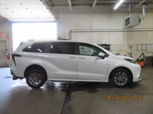 White Toyota Sienna with Driverge Rear Entry Manual Fold Out conversion