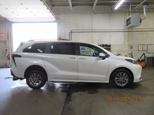 White Toyota Sienna with Driverge Rear Entry Manual Fold Out conversion
