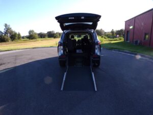 Silver Toyota Sienna with Driverge Rear Entry Manual Fold Out conversion