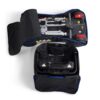 The Buzzaround CarryOn (GB120) electric wheelchair is neatly folded, contained within a partially unzipped black Travel Bag, showcasing the main body and wheels.