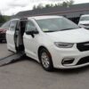 White Chrysler Pacifica with Driverge Side Entry Automatic Fold Out conversion
