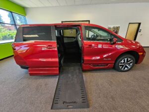 Red Honda Odyssey with BraunAbility Side Entry Automatic In Floor conversion