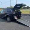 Black Toyota Sienna with Driverge Rear Entry Manual Fold Out conversion