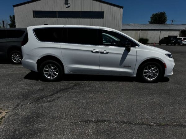 White Chrysler Pacifica with Driverge Rear Entry Manual Fold Out conversion