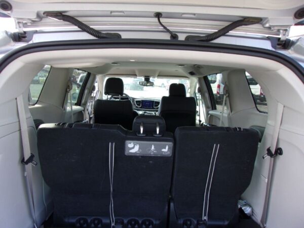 Silver Honda Odyssey with BraunAbility Side Entry Automatic Fold Out conversion