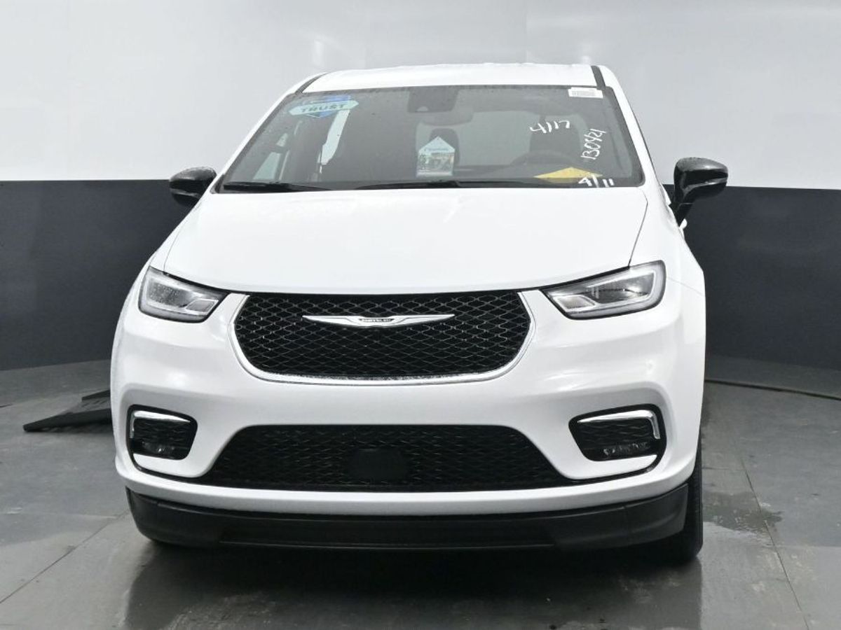 White Chrysler Pacifica with BraunAbility Side Entry Automatic Fold Out conversion