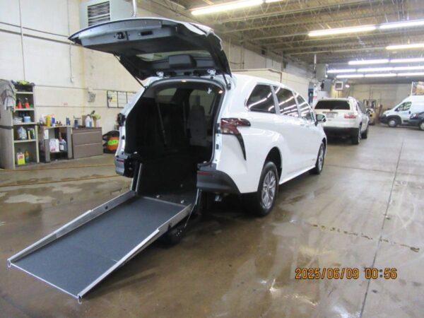 White Toyota Sienna with Driverge Rear Entry Manual Fold Out conversion