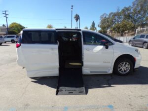 White Chrysler Pacifica with BraunAbility Side Entry Automatic Fold Out conversion