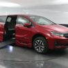 Red Honda Odyssey with BraunAbility Side Entry Automatic In Floor conversion