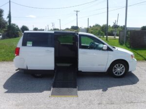 White Dodge Grand Caravan with Driverge Side Entry Automatic Fold Out conversion