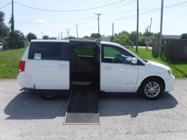 White Dodge Grand Caravan with Driverge Side Entry Automatic Fold Out conversion