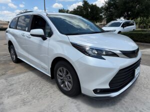 White Toyota Sienna with Driverge Rear Entry Manual Fold Out conversion