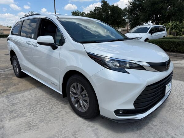 White Toyota Sienna with Driverge Rear Entry Manual Fold Out conversion