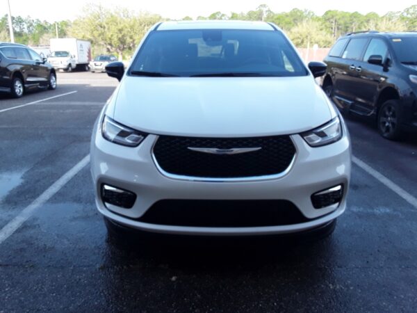 White Chrysler Pacifica with BraunAbility Side Entry Automatic Fold Out conversion