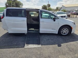 White Chrysler Voyager with Driverge Side Entry Automatic Fold Out conversion