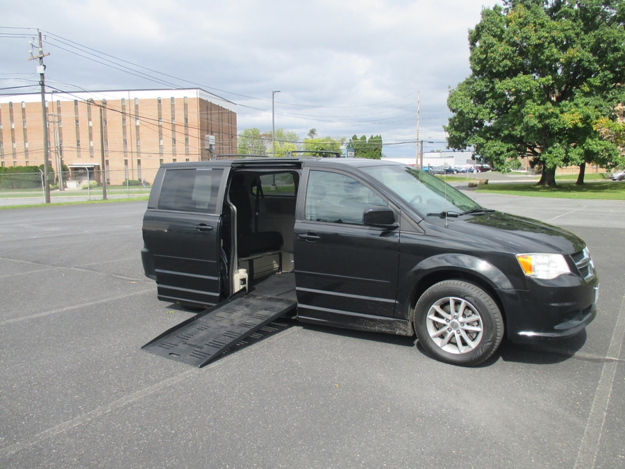 Black Dodge Grand Caravan with BraunAbility Side Entry Automatic Fold Out conversion