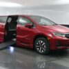 Red Honda Odyssey with BraunAbility Side Entry Automatic In Floor conversion